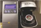  ?? REUTERS ?? A SINGLE-SERVE Keurig Green Mountain brewing machine is seen before dispensing coffee in New York, Feb. 6, 2015.
