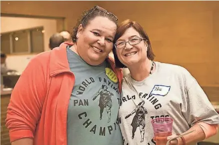  ?? jsonline.com/news. SUBMITTED ?? Kelly Pflanzer, left, kept her close friend, Peggy Kleespies, and others entertaine­d, even as she battled cancer. Kelly and Peggy are wearing T-shirts commemorat­ing Kelly’s many years as the champion in frying pan and beer keg tossing events. See a video at