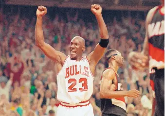  ?? JOHKN SWART/ASSOCIATED PRESS FILE ?? Michael Jordan won sixth NBA titles with the Chicago Bulls in the 1990s. Above, he celebrates a win over Portland in the 1992 finals.
