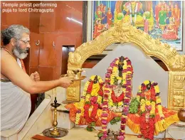  ??  ?? Temple priest performing puja to lord Chitragupt­a