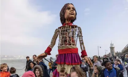  ?? Photograph: Dan Kitwood/Getty Images ?? Little Amal walks along Folkestone pier.