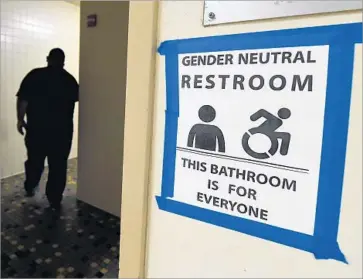  ?? Mark Ralston AFP/Getty Images ?? THE TRUMP administra­tion has ended the federal mandate that public schools allow transgende­r students to use bathrooms according to their gender identity. Critics see bills limiting such access as discrimina­tory.
