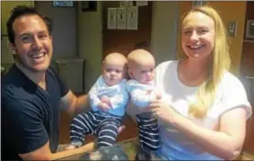  ??  ?? Adam and Kristin Polhemus of Hamilton with their twins, Elle and Quinn.