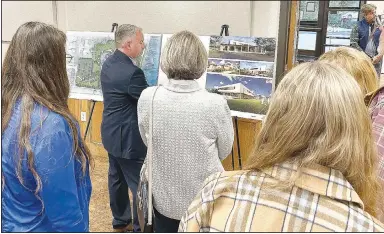  ?? (NWA Democrat-Gazette/Annette Beard) ?? Mayor Nathan See explains plans for a new community center and city park to visitors during the Oct. 17 City Council meeting.