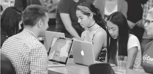  ??  ?? Teens attend a free coding camp courtesy of the Next Big Thing, a foundation started by Hootsuite’s Ryan Holmes to give young people a taste of programmin­g.