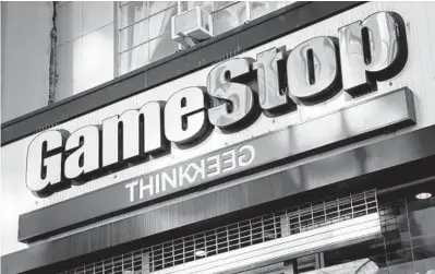  ?? JOHN MINCHILLO/AP ?? Shares in retailer GameStop shot up more than 1,600% in January thanks to a new generation of online traders who band together on social media to champion the same stocks. However, the majority of retirement savers are sticking with their savings plans.