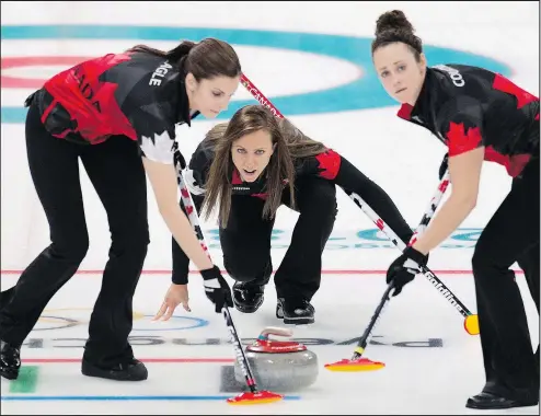  ?? MICHAEL BURNS/THE CANADIAN PRESS ?? Canada skip Rachel Homan (centre), lead Lisa Weagle (left) and second Joanne Courtney make a shot against Great Britain in Gangneung, South Korea, last night. Homan had a one-point lead going into the 10th end, but gave up two points to seal her fate.