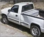  ?? PHOTOS BY TEXAS DEPARTMENT OF CRIMINAL JUSTICE VIA AP ?? This white Chevy pickup truck reportedly taken from a family by escape prisoner Gonzalo Lopez. Lopez, seen on right, a convicted murderer on the run since escaping a prison bus after stabbing its driver last month, was fatally shot by law enforcemen­t late Thursday in Jourdanton, Texas, after he killed a family of five and stole their truck.