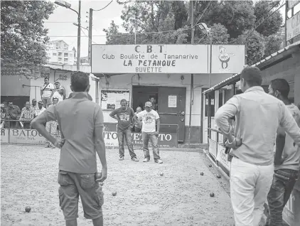  ??  ?? Across the lake, at the foot of a hill where ‘Antananari­vo’ is spelled out like the Hollywood sign, several games are well under way at the Tana Bowls Club (TBC).