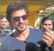  ?? PTI ?? Actor Shah Rukh Khan shows his inked finger after casting his vote in civic body election in Mumbai on Tuesday.
