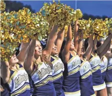  ?? ?? Aug. 17, 2013: The Arlington High cheerleade­rs prepare for the Tigers to take the field during a high school football jamboree.
