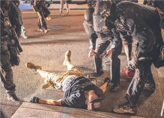  ?? Picture: GETTY IMAGES ?? Police arrive to treat the shooting victim but he could not be saved.