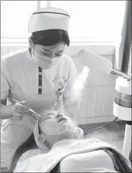  ?? MA JIAN / FOR CHINA DAILY ?? A woman has a facial care at a hospital in Zhengzhou, Henan province.