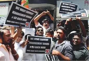  ?? AFP ?? Policemen detain demonstrat­ors holding placards and shouting slogans against Prime Minister Narendra Modi, near the Tamil Nadu governor’s residence, during his visit to Chennai yesterday.