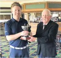  ??  ?? Alastair Waddell receives the trophy in 2019 from Alliance President Ian Brooks