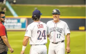  ?? PURSELL ?? IronPigs coach Pat Borders, right, began catching in 1986 with the Blue Jays’ Class-A affiliates. He later spent 17 seasons in the majors and won two World Series titles. CHERYL