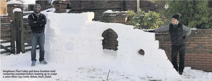  ??  ?? Neighbours Paul Cullen and Anna Goodwin built competing snowmen before teaming up to sculpt a snow Mow Cop Castle. Below, Paul’s Dalek.
