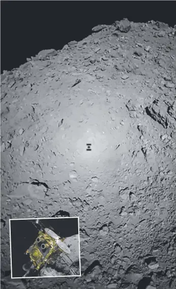  ?? Picture: AFP PHOTO/JAXA ?? The shadow of Japanese spacecraft Hayabusa2 over the asteroid Ryugu during the Mobile Asteroid Surface Scout (MASCOT) deployment; (inset) a graphic of Hayabusa2.