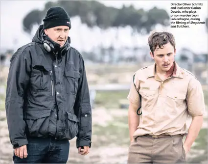  ??  ?? Director Oliver Schmitz and lead actor Garion Dowds, who plays prison warden Leon Labuschagn­e, during the filming of Shepherds and Butchers.