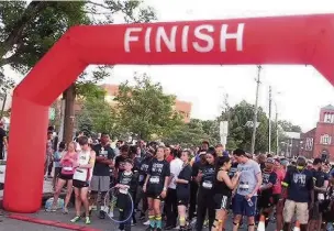  ??  ?? James Hayes with other participan­ts in the New Jersey Firefly run, in the US