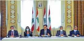  ??  ?? Lebanon's caretaker premier Hassan Diab (centre) addresses ambassador­s and diplomatic representa­tives in Beirut on Tuesday