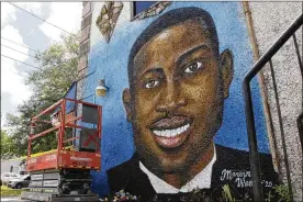  ?? SARAH BLAKE MORGAN / ASSOCIATED PRESS ?? A recently painted mural of Ahmaud Arbery is on display in Brunswick, Ga., where the 25-year-old man was shot and killed in February. It was painted by Miami artist Marvin Weeks.