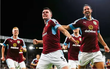  ??  ?? On the rise: Burnley defender Michael Keane (centre) has impressed since leaving Manchester United last year, culminatin­g in his first England call-up this week. — Reuters