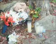  ?? Ned Gerard / Hearst Connecticu­t Media ?? A small memorial remains at the scene where Jorge Tirado’s car collided with a tree after he was shot and killed while driving on Fox Street in Bridgeport on the morning of Sept. 24.