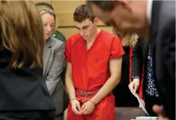  ?? MIKE STOCKER/GETTY IMAGES POOL ?? Nikolas Cruz appears in court with lawyer Melissa McNeil for a status hearing on Monday in Ft. Lauderdale, Fla. Cruz faces 17 charges of premeditat­ed murder in the mass shooting at Marjory Stoneman Douglas High School.