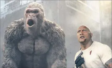  ?? Warner Bros. Entertainm­ent Inc. ?? DWAYNE JOHNSON as Davis Okoye, Jason Liles doing motion-capture role as gorilla George in “Rampage.”