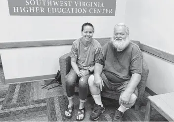  ?? Sarah Rankin / Associated Press ?? Ernest Ray, sits with his niece, Kendra Potter in Abington Va. Ray has been fighting Virginia in court as it tries to recoup jobless benefits he received after being laid off from his job of more than two decades.
