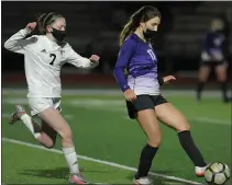  ?? KEN SWART — FOR MEDIANEWS GROUP ?? Bloomfield Hills’ Ava Badallo (17) clears the ball away from Birmingham Groves’ Cabrey O’Gorman during the OAA Red/Blue crossover match played on Thursday at Bloomfield Hills High School. The Black Hawks defeated the Falcons 3-0.