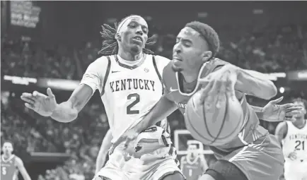  ?? PHOTOS BY MATT STONE/COURIER JOURNAL ?? Kentucky forward Aaron Bradshaw (2) pressures Illinois State forward Kendall Lewis during the second half as the Wildcats rolled past Illinois State 96-70 at Rupp Arena on Friday night in Lexington.