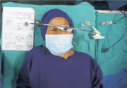  ?? NIRANJAN SHRESTHA ?? A patient recovers after receiving anesthesia before cataract surgery at the Tilganga Eye Centre in Kathmandu, Nepal, in March.