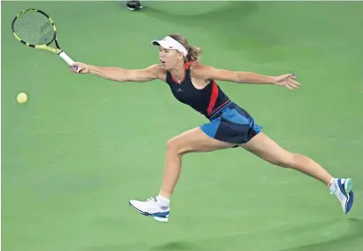  ?? AFP ?? Caroline Wozniacki hits a return against Rebecca Peterson during their women’s singles third round match at the Wuhan Open. —