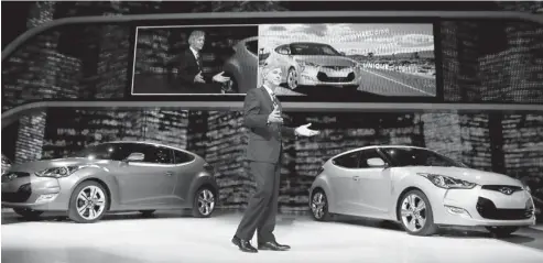  ?? ANDREW HARRER BLOOMBERG NEWS ?? John Krafcik, president and chief executive of Hyundai’s America unit, speaks after unveiling the Veloster compact in Detroit last January.