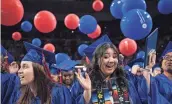  ?? ?? Balloons drop on graduates as Mesa Community College’s commenceme­nt ceremony comes to an end in Tempe on Saturday.