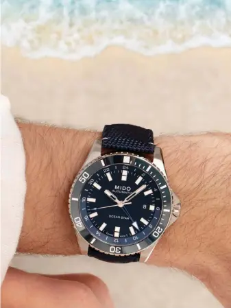  ??  ?? Mido Ocean Star GMT in stainless steel case and blue ceramic bezel with fabric strap