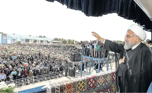  ?? Picture: AFP ?? TICKING TIME BOMB: President Hassan Rouhani addresses the crowds during a rally in the northweste­rn city of Sabzevar. Rouhani said on Sundaythat if the US quits the nuclear deal between Tehran and world powers, then Washington would regret it ‘like...