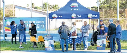  ?? Picture: RANDELL ROSKRUGE ?? TIME TO VOTE: Supporters of the candidates in ward 18 cast their votes at the Kingsway Tennis Club in Schultz Road yesterday morning