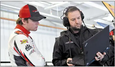  ?? Photo courtesy of Joe Gibbs Racing ?? Before becoming a crew chief at the Cup Series level for Joe Gibbs Racing, Little Rock’s Chris Gayle (right) spent 10 years as a race engineer and another four as an Xfinity Series crew chief. Gayle’s driver, Erik Jones (left), will start on the outside of the front row for tonight’s race at Kentucky Speedway.