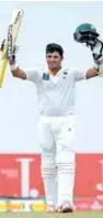  ?? – AP/PTI ?? CLASSIC KNOCK: Pakistan’s Azhar Ali celebrates scoring a century in Colombo.