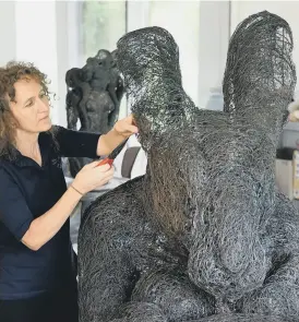  ?? PICTURES: CHRISTOPHE­R FURLONG-GETTY IMAGES/SIMON HULME/ TANYA DOLVERS ?? WORK IN PROGRESS:
Above, sculptor Sophie Ryder at work in her studio; right, The Minotaur and The Hare on a Bench and left, The Lady-Hare both of which can been seen at the Piece Hall; inset, Sophie Ryder sketching one of her designs