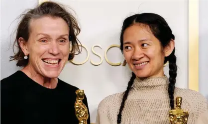  ?? Photograph: Getty Images ?? Frances McDormand and Chloé Zhao with their Nomadland Oscars.
