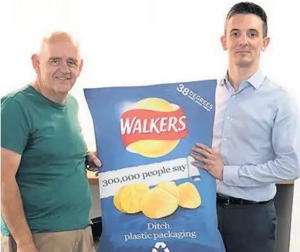  ??  ?? Geraint Ashcroft with Duncan Gordon from PepsiCo. Geraint started a petition to ask Walkers to make crisp packets recyclable