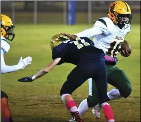  ??  ?? Jose Devoux (16) of the Vikings sti arms a defender during his team’s 20-0 win over the Vincent Memorial Scots on Oct. 18. Devoux has Holtville’s number one option on o ense all year, accumulati­ng 1,501 yards on the ground. PHOTO AARON BODUS