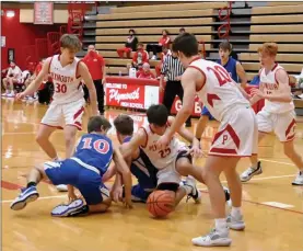  ?? PILOT PHOTO/MAGGIE NIXON ?? It’s a scrum for the ball in the closing seconds between Easton Strain and Whitko’s Drake Lewis and Brett Sickafoose as Owen Yoder, Tanner Feece and Nolan Bales come to help. Strain would grab the ball to secure the Plymouth win in the final seconds.