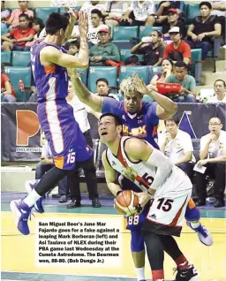  ??  ?? San Miguel Beer’s June Mar Fajardo goes for a fake against a leaping Mark Borboran (left) and Asi Taulava of NLEX during their PBA game last Wednesday at the Cuneta Astrodome. The Beermen won, 88-80. (Bob Dungo Jr.)