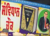  ?? HT FILE PHOTO ?? A board with the name Samvidhan Chowk in Punjabi and a photo of
Dalit icon BR Ambedkar, who is regarded as the Constituti­on’s main architect, was put up on April 13 at a roundabout otherwise known as Gol Chowk. This had led to violent clashes between...