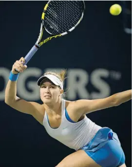  ?? FRANK GUNN/THE CANADIAN PRESS ?? Eugenie Bouchard, Westmount, Que., returns to Petra Kvitova of the Czech Republic during their Rogers Cup match in Toronto on Wednesday. Bouchard lost in two sets, 6-3, 6-2.